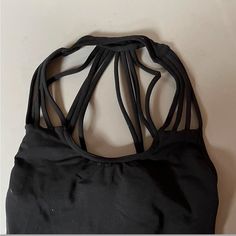 Vintage Capezio, Not Sold Anymore. Never Worn, No Signs Of Wear. Tag Is Not On The Leo, But I Would Say Best Fit For A Size Small. Black Tank Top With Built-in Bra And Strappy Back, Black Top With Built-in Bra And Strappy Back, Black Tops With Built-in Bra And Strappy Back, Black Backless Tank Top For Beach, Sleeveless Stretch Dancewear Tops, Black Stretch Strappy Swimwear, Black Halter Neck Tank Top For Sports, Black Strappy Tank Top For The Beach, Black Fitted Swimwear With Crisscross Straps