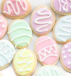 decorated cookies are arranged in the shape of letters