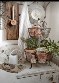 an old dresser with pots and pans on top of it, in a kitchen