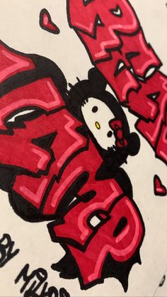 an image of graffiti on the back of a t - shirt that is red and black