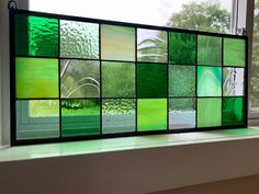 a window with many different colored glass panels