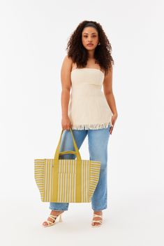 Designed to go straight from your flight to the beach, this is the ultimate summer tote bag. It’s truly the best of both worlds with a chic, yarn-dyed custom stripe design inspired by summers in Europe, plus an interior packed with all of our 5-star functional features. Open this timeless tote to find a wipeable lining, organized slip pockets, and interior water bottle holders. Easy to carry (thanks, removable crossbody strap), perfect for styling, and made from durable recycled cotton, we’d boo Summer Tote Bag, Summer Tote Bags, Summer Tote, Europe Summer, Water Bottle Holders, Yellow Stripes, Bottle Holders, Crossbody Strap, Recycled Cotton