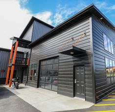 an industrial building with metal siding and windows