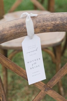 a wooden chair with a tag attached to it