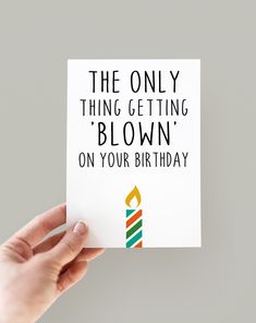 someone holding up a birthday card that says the only thing getting blown on your birthday