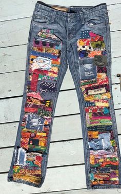 a pair of jeans with colorful patches on them