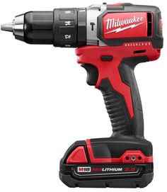 the milwaukee power drill is shown in red and black