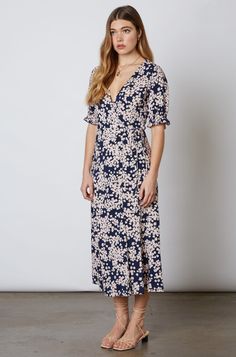 Turn heads when you dress up in the Daisy Blooms Navy Floral Print Wrap Midi Dress! Lightweight navy woven fabric, covered in clusters of blush and yellow daisy's, shapes this stunning dress with a V-neckline and surplice wrap bodice, framed by short, puff sleeves. A matching wrap midi skirt starts at a high empire waist. Wrap Dress Midi, Wrap Midi Skirt, Boho Midi Dress, Office Outfits Women, Yellow Daisies, Midi Wrap Dress, Womens Floral Dress, Wrap Midi Dress, Pink Boho