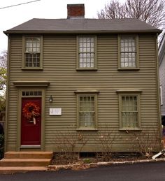 a house with a wreath on the front door