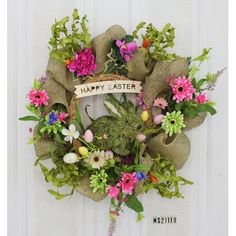 a happy easter wreath hanging on a door