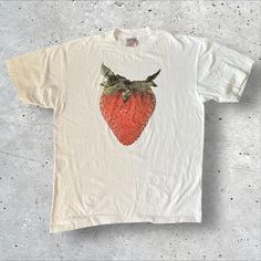 Strawberry Graphic Tee - Fresh Fruit-Inspired Casual Fashion Add a touch of freshness to your wardrobe with this tee featuring a bold strawberry graphic. Ideal for those who love fruity and fun designs. 👕 Material: 100% Cotton 🎨 Design: Bold Strawberry Graphic 📏 Sizes: M-3XL ⏳ Custom Creation Time: Please allow 1-2 weeks for production. #StrawberryTee #FruitFashion #GraphicTshirt #CasualWear #CustomApparel #UniqueFashion T Shirt Sleeve Design, White T-shirt With Fruit Design For Spring, Cotton T-shirt With Strawberry Print, Cotton Short Sleeve T-shirt With Strawberry Print, White Relaxed Fit T-shirt With Strawberry Print, Casual White Tops With Fruit Design, White Casual Top With Fruit Design, Casual White Top With Fruit Design, White T-shirt With Strawberry Print For Spring