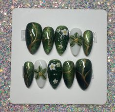 Hand made custom gel press on nails.  These nails are made to order specially for you! Whether you want to go the extra mile for a special event, or just want to feel fancy in your day to day life, these precious custom press on nails are for you. Inspired by the green nature, and flowing waters of Thailand, these nails bring me back to one of my favorite vacation memories. Cat eye polish layered with green jelly give a unique shimmering effect. The 3d aspect of the middle nail gives the illusion of flowing water, and the 3d hand carved flower on the ring finger makes this set super unique. You will surely get compliments on this set!   Please note picture with instructions on how to measure your nails.  See instructions when choosing "custom" in size options Green 3d Nail Art, Pretty Green Nail Designs, Very Natural Nails, Green And Red Nail Designs, Green Mushroom Nails, Green Cat Eye Nails Design, Nails Green Design, Green Cat Eye Nails, Cat Eye Polish