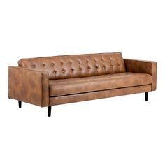 a brown leather couch sitting on top of a white floor