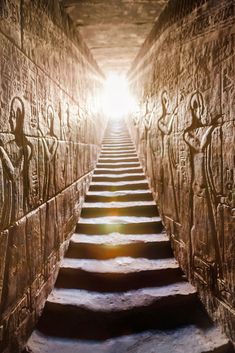 the sun is shining down on some steps in an ancient building with carved walls and carvings