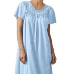 This Long Nightgown Effortlessly Layers The Bodice For A Comfortable And Free-Flowing Fit That Compliments All Body Types. It Fashions A Delicate Flutter Sleeve And Floral Pattern Lining The Neck To Add A Feminine Touch. This Ensemble Comes In A Soothing Array Of Colors And Pairs Perfectly With Our Petals Button-Down Bathrobe. Flutter Sleeve Nightgown With Embroidered Flower Petal Design Along Scalloped Neckline Our Signature Petals Embroidered Yoke Usa Fabric 100% Opacitrique Nylon Tricot 53″ L Light Blue Sleep Dress, Light Blue Lace Trim Dress For Loungewear, Blue Short Sleeve Dress For Night, Blue Lace Trim Dress For Loungewear, Blue Nightgown For Loungewear, Light Blue Nightgown For Home, Light Blue Spring Sleepwear, Blue Short Sleeve Sleepwear For Night, Light Blue Short Sleeve Sleep Dress