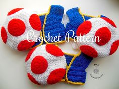 three crocheted shoes with red, white and blue balls on them