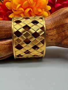 Joan Rivers Basket weave gold bracelet.  Simply gorgeous!  Classic Joan Rivers style and elegance.  This bracelet is stunning!  It is in like new condition!  This bracelet can take any outfit to the next level.  Each layer of the lattice or basket is etched and sparkles.  Joan Rivers mark on the inside of the bracelet.  The bracelet can be expanded or contracted to fit most.  1.75" wide.  You won't be disappointed.  Great gift. Packaged for gifting.  Free Shipping. Gold Woven Bracelet Jewelry, Vintage Gold Braided Bracelets As Gift, Gold Metal Braided Bangle Bracelet, Gold Metal Bangle Braided Bracelet, Formal Gold Braided Jubilee Bracelet, Formal Gold Braided Jubilee Style Bracelet, Gold Woven Bracelet As Gift, Gold Woven Bracelets As Gift, Gold Jewelry With Interwoven Design As Gift