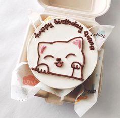 a birthday cake in the shape of a cat