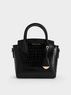 Luxurious and functional, this Harper top handle bag with a croc-effect finish will easily become a new favourite that you will reach for again and again. Whether you are headed to work, evening events or a special occasion, it will be a fabulous style companion. Plus, in black, it will always be a failproof choice that will match with everything in your wardrobe - perfect for days when you want to look classy with effortless ease. Burgundy Bag, Chic Crossbody Bag, Structured Top, Classic Handbags, Size Chart For Kids, Charles Keith, Printables Kids, Handle Bag, Black Tote Bag