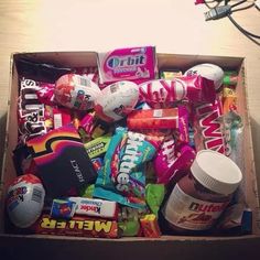 an open box filled with candy and snacks