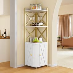 a white and gold shelving unit with wine glasses on it in a living room