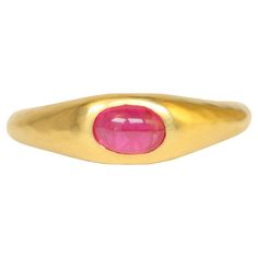 This handcrafted gypsy ring is a true standout, featuring a radiant 0.60ct oval cabochon ruby set in luxurious 22K yellow gold. Its matte hammered finish complements the vibrant ruby, making it a perfect piece for the discerning jewelry lover. The ring’s tapered band with rounded inner edges ensure both style and comfort for all-day wear. Our ruby gypsy ring makes a statement on its own, but also pairs beautifully with other gypsy rings for a stacked look. - Size: 6 1/4 - Center Stone: 0.60ct ov 22k Gold Ring, Ruby Set, Light Blue Sapphire, Modern Engagement Rings, Modern Ring, Fine Jewelry Collection, Oval Cabochon, Jewelry Lover, Ring Handmade