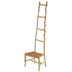 a wooden ladder leaning up against a white wall