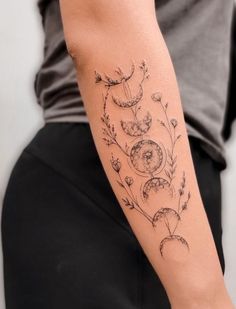 a woman with a tattoo on her arm