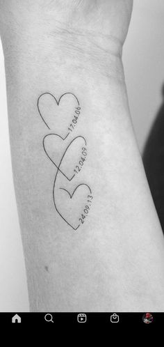 a couple of hearts with the words i love you written on their wrist tattoo design