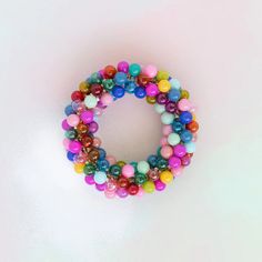 multicolored beaded bracelet on white background