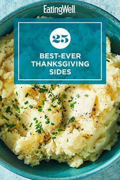 a blue bowl filled with mashed potatoes covered in gravy and topped with parsley