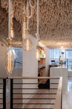 the ceiling is covered in many different types of light bulbs