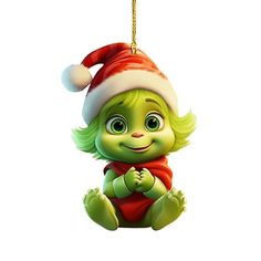 a christmas ornament with a green troll wearing a santa hat