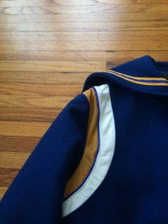 This is a great vintage Letterman jacket that is ready for a new home and life right now. If you want to look amazing this fall and winter, and stay warm as well, get this today. It is in great condition and is ready to make your life amazing. There are no rips, holes, stains or smells. Measurements: Pit to pit: 24 3/4 inches Collar to bottom front: 23 inches Collar to bottom back: 27 1/4 inches Sleeve Length (from collar): 32 1/2 inches Size on tag: Medium Retro Blue Outerwear With Buttons, Vintage Navy Outerwear For Outdoor, Vintage Blue Sport Coat For Fall, Vintage Outdoor Sport Coat With Buttons, Vintage Sport Coat With Buttons For Outdoor, Navy Retro Varsity Jacket With Long Sleeves, Vintage Blue Outerwear For College, Navy Fitted Retro Outerwear, Fitted Navy Retro Outerwear