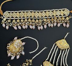 This lightweight and dainty set in thapa kundan or multani work is made of high quality gold plating and has gorgeous pink crystal drops that have an ombre finish. The colors are super unique and pastel so that they can go with any outfit whether its a saree or lehenga! and can be worn separately for a simple look. This lightweight and elegant necklace is perfect for any bridesmaid, bride, sangeet or any occasion or event as a gift for any occasion as any one who loves jewelry will love this sta Elegant Pink Kundan Jewelry Sets, Elegant Pink Kundan Sets, Pink Kundan Sets With Cutdana, Pink Bridal Sets For Festive Occasion Gift, Pink Bridal Sets For Festive Gift, Pink Bridal Sets For Festive Occasion, Elegant Pink Bridal Set With Stone Work, Festive Pink Bridal Sets As A Gift, Gold Kundan Sets For Eid