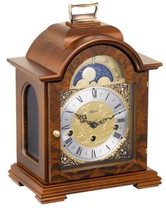 an antique wooden clock with roman numerals