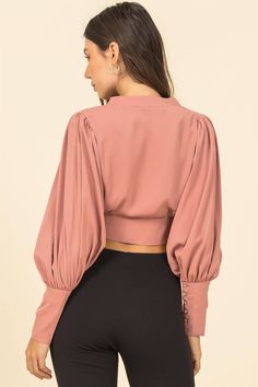 100% polyester Model is 5' 8", 32' chest, 24' waist and 34' hips and wearing a size small. Available in black or pink. Fitted Blouson Sleeve Party Tops, Fitted Feminine Solid Blouse, Pink Bishop Sleeve Blouse For Fall, Chic Fitted Blouse With Balloon Sleeves, Fall Pink Bishop Sleeve Blouse, Fall Puff Sleeve Crop Top, Chic Long Sleeve Crop Top With Blouson Sleeves, Fall Puff Sleeve Blouse For Night Out, Chic Fall Crop Top With Blouson Sleeves