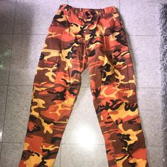 Orange Camo Pants Tie String Ends Adjustable Elastic Waist Waist: 27 In To 31 In Inseam: 29.5 To 32.5 In In Really Good Shape - I’ve Never Worn. Orange Camo Pants, Orange Camo, Camo Pants, Pants Color, Color Orange, Pant Jumpsuit, Camo, Elastic Waist, Pants For Women