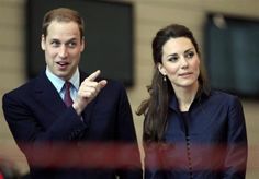 prince william and kate are standing next to each other