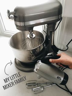 a person is using a mixer to mix something in a bowl with the words my little mixer family on it