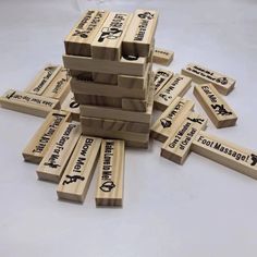 several wooden blocks stacked on top of each other with the words foot massage printed on them