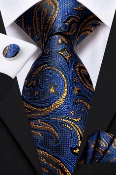 Treat yourself with a new pattern and splash of color to your look with this unique tie set. 100% Silk Handmade Package Includes: Tie, Pocket Square & Cufflinks. Length: 59" Width: 3.34" Warm iron if needed We offer FREE International Shipping World Wide! Blue And Gold Suits For Men, Navy And Gold Suit, Luxury Blue Ties For Business, Luxury Blue Suit And Tie Accessories For Office, Elegant Blue Tie For Business, Luxury Blue Suit And Tie Accessories For Semi-formal Occasions, Elegant Blue Suit And Tie Accessories For Office, Classic Royal Blue Suit And Tie Accessories For Business, Blue Elegant Suit And Tie Accessories For Formal Occasions