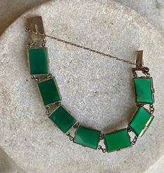 Art Deco Green Chrysoprase Sterling Siliver Vintage Antique Bracelet The bracelet measures 7 inches long See matching necklace in link below https://www.etsy.com/listing/897112044/art-deco-green-chrysoprase-sterling?ref=shop_home_active_1&frs=1 Green Jewelry With Extender As Gift, Antique Green Handmade Bracelet, Handmade Antique Green Bracelet, Green Art Deco Bracelets As A Gift, Green Art Deco Bracelets As Gift, Green Art Deco Bracelets For Gift, Green Art Deco Bracelet As Gift, Antique Green Rectangular Jewelry, Vintage Green Rectangular Jewelry