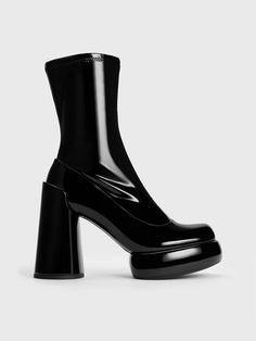 Every modern woman needs a pair of platform boots in her fashion arsenal. The minimalist design complete in an all-black finish allows the simple but bold details to fully stand out. From the thick outer platform soles to the outstanding 10cm block heels, these Darcy boots are made to elevate your style to new heights. Bold Platform Boots With Chunky Platform, Modern Black Platform Boots, Modern Black Heeled Boots With Chunky Platform, Modern Black Platform Boots With Reinforced Heel, Modern High Ankle Platform Boots With Chunky Platform, Party Platform Boots With Lug Sole And Block Heel, Chic Black High-cut Heeled Boots, Modern Platform Boots With Sculpted Heel, Modern Black Mid-calf Boots With Sculpted Heel