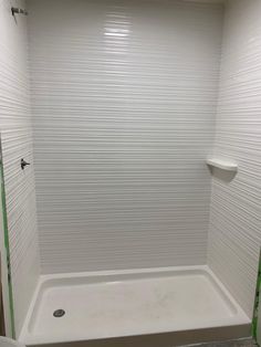 a bathroom with a shower, toilet and tub in it's stall area that is being remodeled