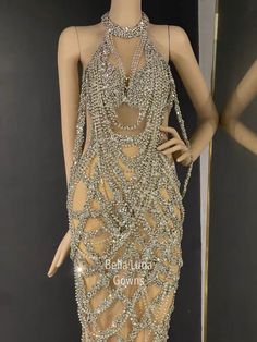 a mannequin wearing a dress made out of beads