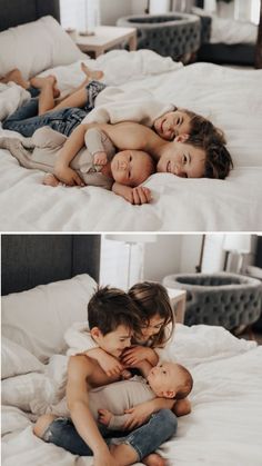 two children laying on top of each other on a bed with white sheets and pillows