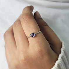 This Ring comes with a 100% Natural Blue Iolite Gemstone and it is made up of 925 solid sterling silver. This ring is handcrafted by our skilled craftsmen and designed by us. Every gemstone is handpicked for the best quality.  Materials:- Silver (925 Solid Sterling Silver) Item Weight :- 1.5 Gram Approx. Gemstone:- Natural Blue Iolite Stone Size :- 4MM Stone Shape :- Square Cut Select Size in Variation, if you don't find perfect size please buy any size and message us your size we'll make. Payme Modern Sterling Silver Birthstone Ring For Everyday, Modern Stackable Topaz Ring For Gifts, Modern Stackable Topaz Ring As Gift, Sterling Silver Birthstone Ring For Everyday, Everyday Sterling Silver Birthstone Ring With Gemstone, Minimalist Amethyst Birthstone Promise Ring, Sterling Silver Gemstone Stackable Promise Rings, Sapphire Sterling Silver Rings Gift, Modern Sterling Silver Sapphire Ring As A Gift