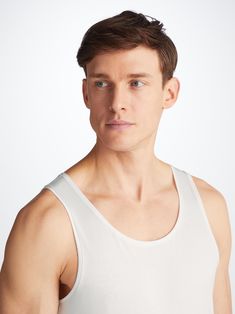 Featuring soft, narrow binding on the scooped neck and armholes that are shaped for comfort and ease of movement. An effortless underwear basic or everyday layering option. Crafted from an ultra-soft blend of 92% Pima cotton 8% elastane, that looks as good as it feels. This vest will provide a comfortable foundation for layering season after season. The model is 6'1" / 185cm tall. He wears a size Medium. Fitted Seamless Brief Slip, White Sleeveless 4-way Stretch Activewear, Sporty White Moisture-wicking Boxer Briefs, White Moisture-wicking Sports Boxer Briefs, Calvin Klein Cotton Boxer Briefs Multi-pack, Derek Rose, Cotton Vest, Jack White, Pima Cotton