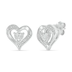 Add a sweet touch to your casual looks with these darling heart stud earrings. Fashioned in sterling silver, each heart-shaped earring shimmers with a diamond accent - artfully set to enhance size and sparkle - at the center. The open border glistens with ribbons of diamond accents and beaded details. Buffed to a brilliant luster, these post earrings secure comfortably with friction backs. Heart-shaped Sterling Silver Diamond Earrings For Gift, Heart-shaped Sterling Silver Diamond Earrings, Valentine's Day Sterling Silver Diamond Earrings, White Gold Heart Cut Earrings For Mother's Day, Mother's Day Heart Cut White Gold Earrings, Sterling Silver Heart-shaped Diamond Earrings For Valentine's Day, Silver Heart-shaped Diamond Earrings For Anniversary, White Heart Earrings With Diamond Accents, Valentine's Day Heart-shaped Silver Diamond Earrings